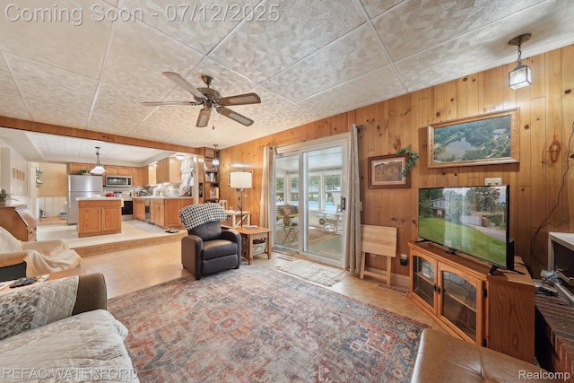 11857 Ely Rd, Davisburg, MI 48350 - living room with wood walls and ceiling fan