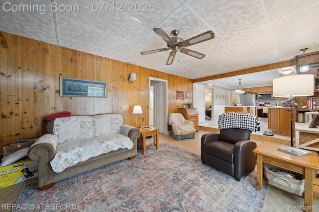 11857 Ely Rd, Davisburg, MI 48350 - living room with a ceiling fan and wooden walls