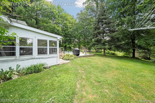 11857 Ely Rd, Davisburg, MI 48350 - view of grassy yard with a wooden deck