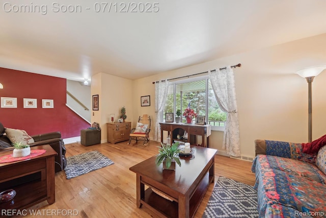 11857 Ely Rd, Davisburg, MI 48350 - living area featuring stairs and light wood finished floors