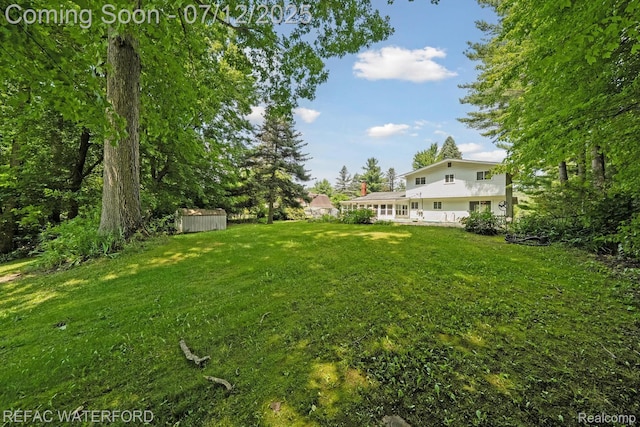 11857 Ely Rd, Davisburg, MI 48350 - view of green lawn with a storage unit