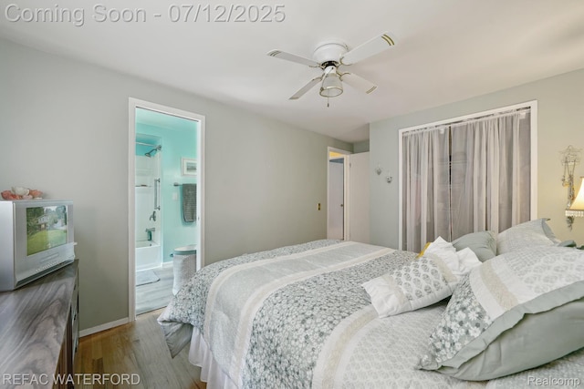 11857 Ely Rd, Davisburg, MI 48350 - bedroom featuring wood finished floors, ceiling fan, and ensuite bathroom