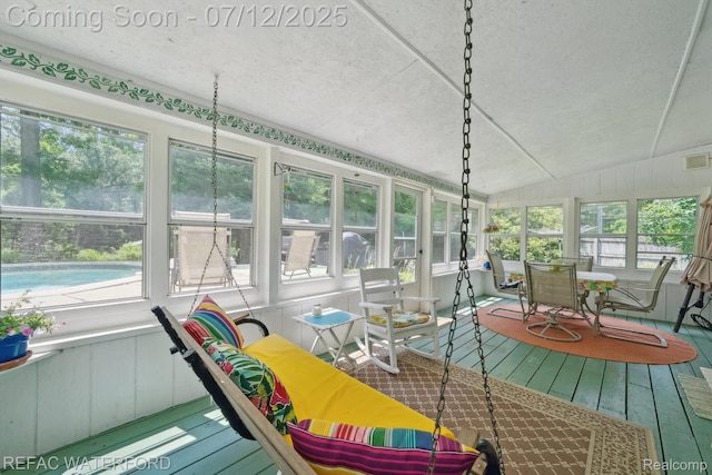 11857 Ely Rd, Davisburg, MI 48350 - sunroom featuring a textured ceiling, wood-type flooring, and vaulted ceiling