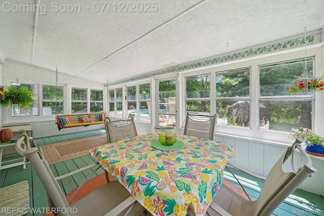 11857 Ely Rd, Davisburg, MI 48350 - sunroom / solarium with healthy amount of natural light, vaulted ceiling, and outdoor dining area