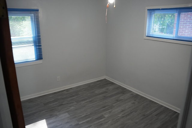 6422 Evergreen Rd, Detroit, MI 48228 - unfurnished room featuring plenty of natural light, dark wood-style flooring, and a ceiling fan