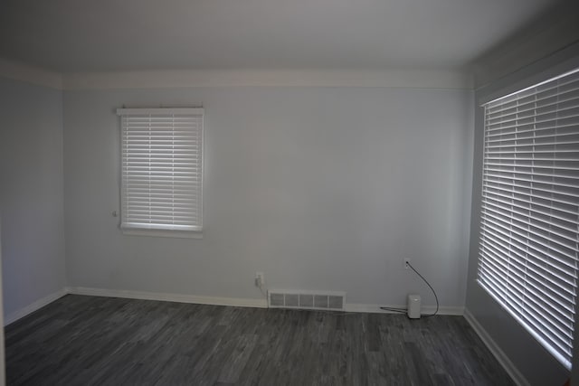 6422 Evergreen Rd, Detroit, MI 48228 - empty room featuring dark wood-style flooring and baseboards