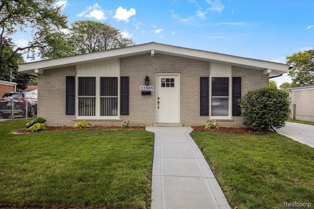 22809 Detour St, Macomb, MI 48082 - view of front facade with brick siding and a front yard
