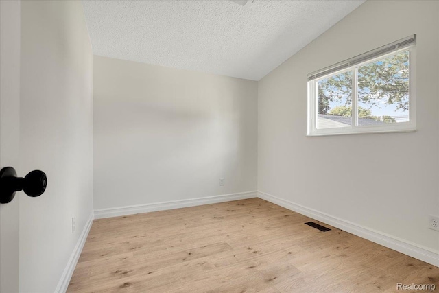 22809 Detour St, Macomb, MI 48082 - empty room with wood finished floors and a textured ceiling