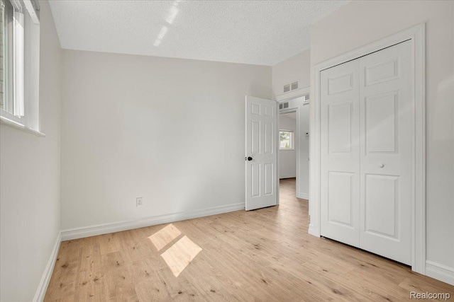 22809 Detour St, Macomb, MI 48082 - unfurnished bedroom with wood finished floors and a closet