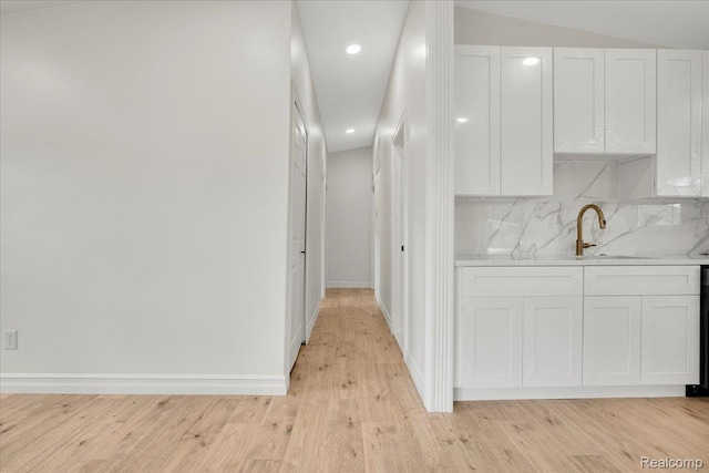22809 Detour St, Macomb, MI 48082 - kitchen with white cabinets, light countertops, light wood-style floors, backsplash, and recessed lighting