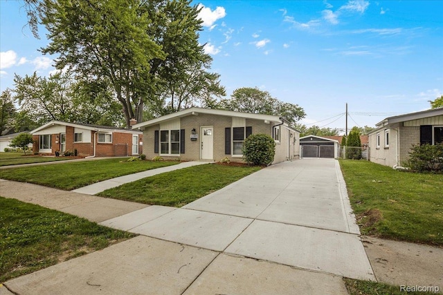 22809 Detour St, Macomb, MI 48082 - mid-century modern home featuring a front lawn, brick siding, driveway, and a detached garage