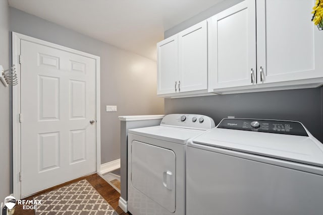 9164 Emily Dr, Davison, MI 48423 - washroom featuring separate washer and dryer, cabinet space, and dark wood-style flooring