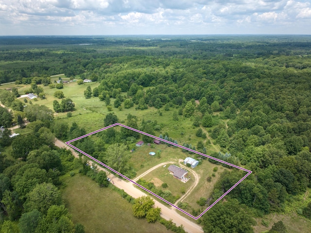4180 15 Mile Rd, Barryton, MI 49305 - aerial view of property and surrounding area with a heavily wooded area and property boundaries highlighted