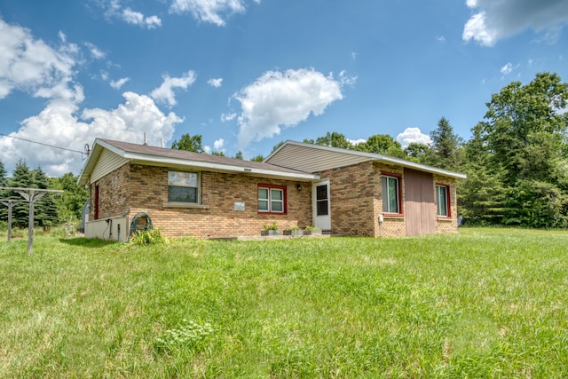 4180 15 Mile Rd, Barryton, MI 49305 - view of front facade with brick siding and a front lawn