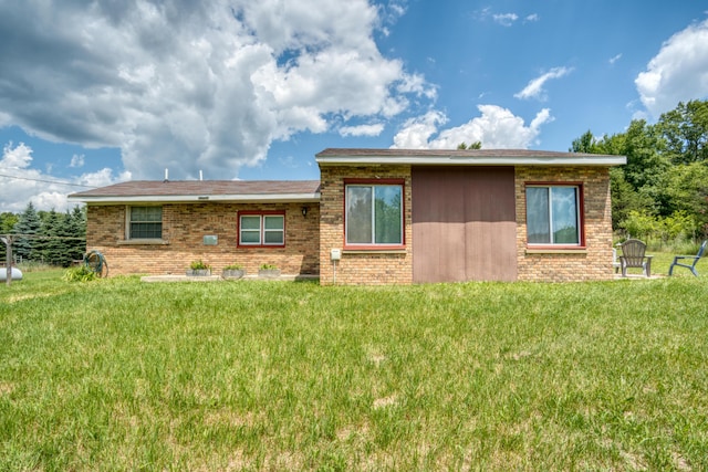4180 15 Mile Rd, Barryton, MI 49305 - view of front of house featuring brick siding and a front lawn