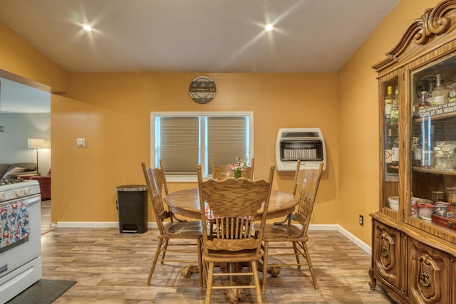 4180 15 Mile Rd, Barryton, MI 49305 - dining room with heating unit and light wood-type flooring