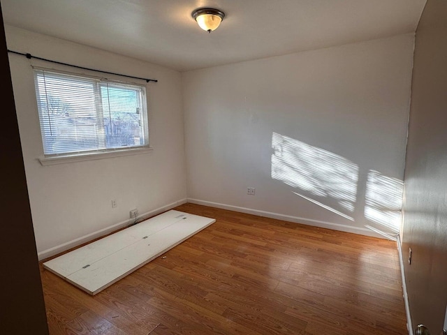 26235 Southwestern Hwy, Redford, MI 48239 - empty room featuring wood finished floors and baseboards