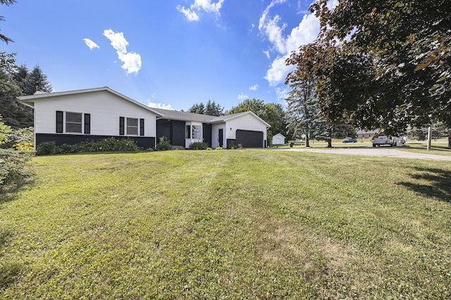 14555 Fruit Ridge Ave, Kent City, MI 49330 - ranch-style house with a garage and a front lawn