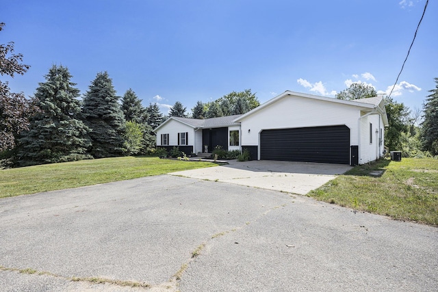 14555 Fruit Ridge Ave, Kent City, MI 49330 - ranch-style home featuring an attached garage, a front yard, and concrete driveway