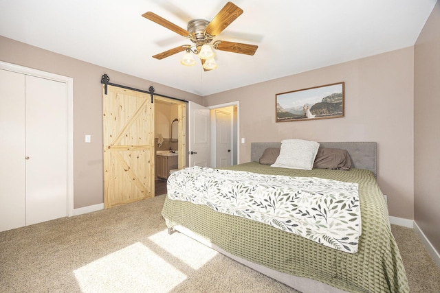 14555 Fruit Ridge Ave, Kent City, MI 49330 - bedroom featuring carpet, a barn door, a closet, and ensuite bathroom