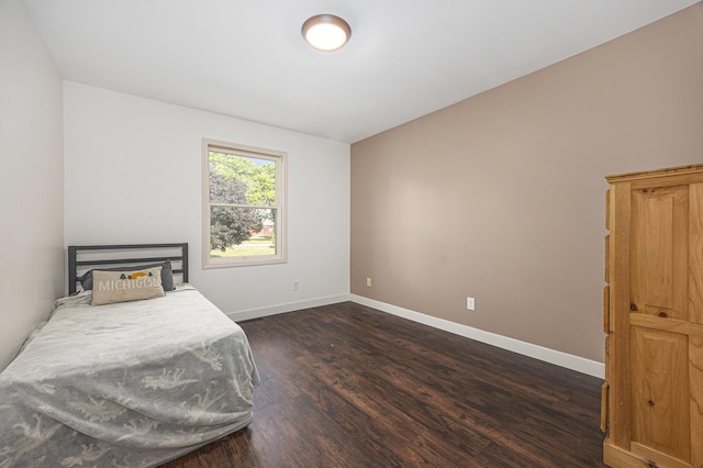 14555 Fruit Ridge Ave, Kent City, MI 49330 - bedroom with dark wood-type flooring and baseboards