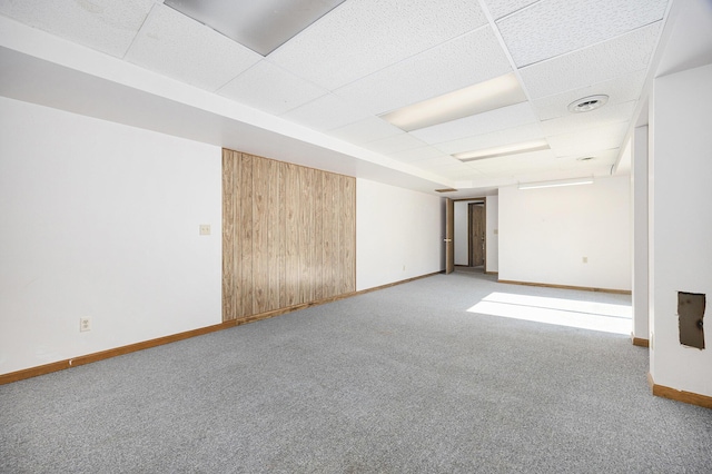 14555 Fruit Ridge Ave, Kent City, MI 49330 - carpeted spare room with a paneled ceiling and baseboards