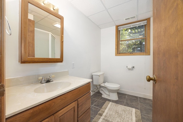 14555 Fruit Ridge Ave, Kent City, MI 49330 - bathroom with vanity, a drop ceiling, tile patterned floors, and a shower with door