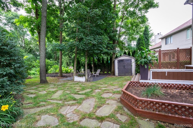 3845 Beechcrest, Rochester Hills, MI 48309 - view of yard featuring a storage unit, a patio, and a wooden deck