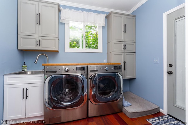 3845 Beechcrest, Rochester Hills, MI 48309 - laundry room with cabinet space, washing machine and clothes dryer, wood finished floors, and ornamental molding