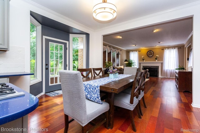 3845 Beechcrest, Rochester Hills, MI 48309 - dining space featuring dark wood-type flooring, ornamental molding, and a fireplace