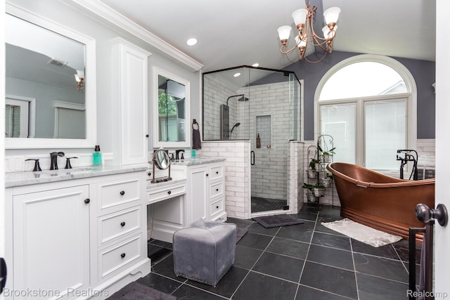 3845 Beechcrest, Rochester Hills, MI 48309 - bathroom featuring vanity, a shower stall, a freestanding tub, vaulted ceiling, and a chandelier