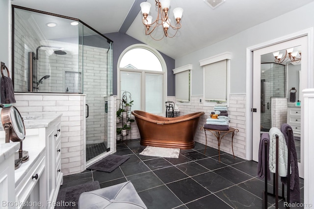 3845 Beechcrest, Rochester Hills, MI 48309 - full bathroom featuring a chandelier, tile walls, vanity, a freestanding bath, and a stall shower