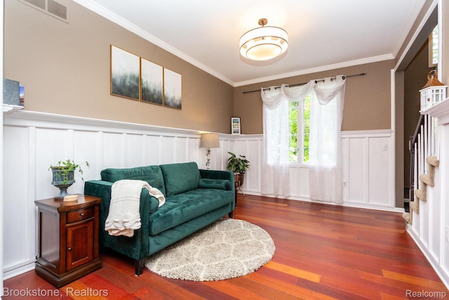 3845 Beechcrest, Rochester Hills, MI 48309 - living room with crown molding, stairs, wood finished floors, a decorative wall, and wainscoting