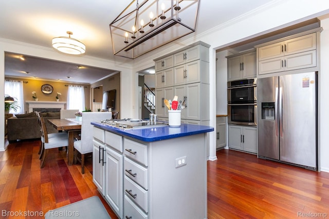 3845 Beechcrest, Rochester Hills, MI 48309 - kitchen with stainless steel appliances, dark countertops, dark wood finished floors, open floor plan, and crown molding