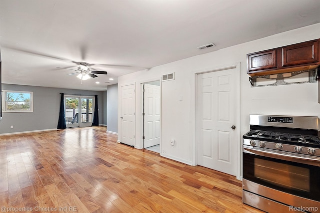 8873 Lagoon Dr, Brighton, MI 48116 - kitchen featuring stainless steel range with gas stovetop, light wood-style flooring, ceiling fan, open floor plan, and recessed lighting
