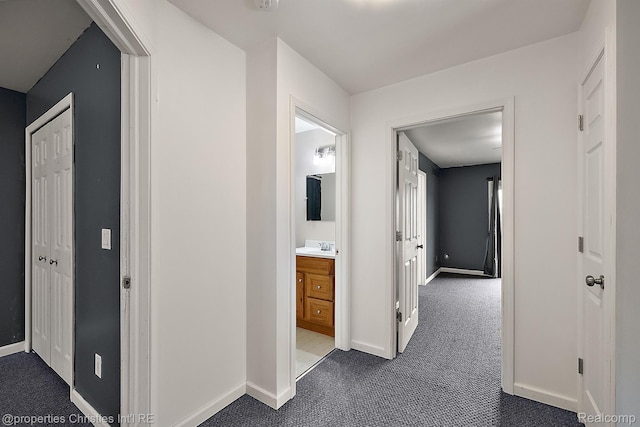 8873 Lagoon Dr, Brighton, MI 48116 - corridor featuring dark colored carpet