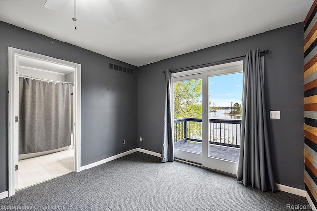 8873 Lagoon Dr, Brighton, MI 48116 - unfurnished room featuring carpet, a water view, and ceiling fan