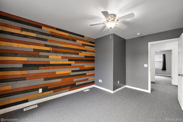 8873 Lagoon Dr, Brighton, MI 48116 - spare room with a ceiling fan, dark colored carpet, and a smoke detector