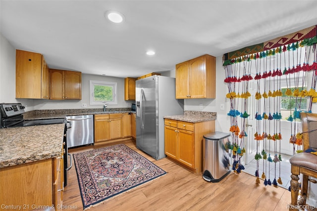 45055 Mcbride Ave, Van Buren, MI 48111 - kitchen with stainless steel appliances, light wood-type flooring, recessed lighting, and light stone counters