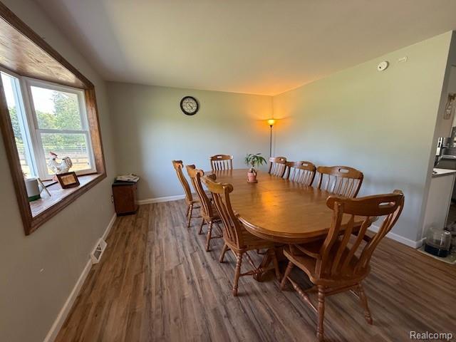 3120 Bruisee Rd, Marlette, MI 48723 - dining area featuring wood finished floors and baseboards