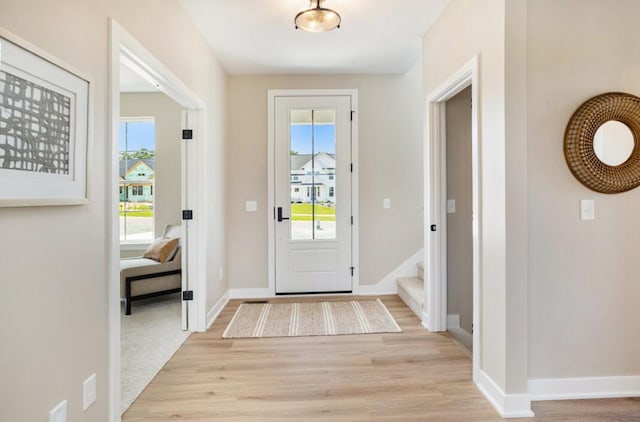 9088 N 34th St, Richland, MI 49083 - foyer with light wood-style floors and stairs