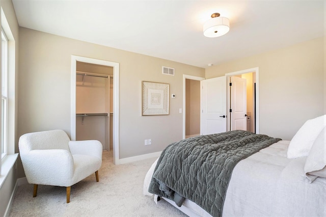 9088 N 34th St, Richland, MI 49083 - bedroom with light colored carpet, a closet, and a spacious closet
