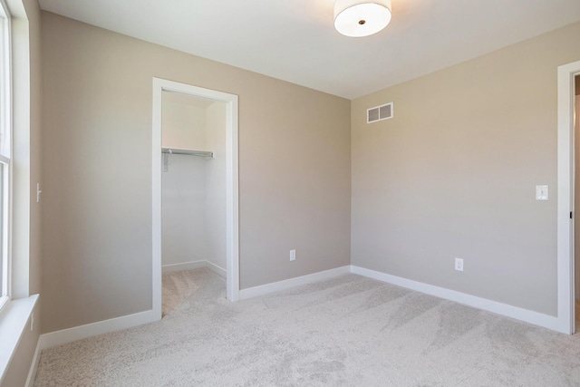 9088 N 34th St, Richland, MI 49083 - unfurnished bedroom with carpet flooring, a spacious closet, and a closet
