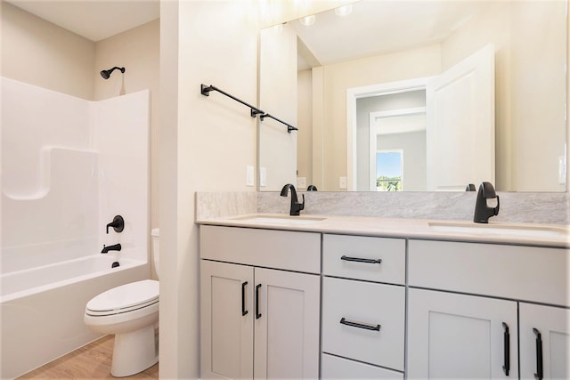 9088 N 34th St, Richland, MI 49083 - full bathroom featuring double vanity, wood finished floors, and washtub / shower combination