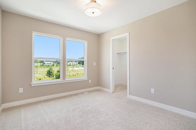 9088 N 34th St, Richland, MI 49083 - empty room with healthy amount of natural light and light colored carpet