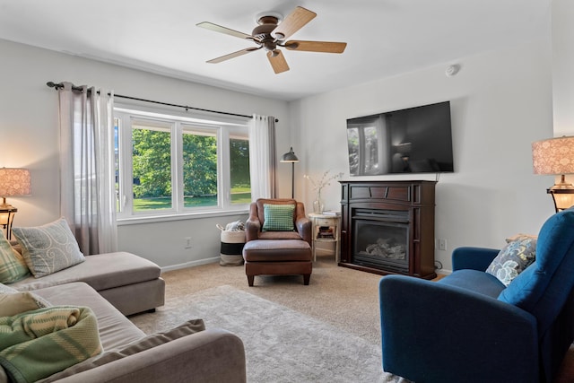 5160 Barker Rd, Jonesville, MI 49250 - living area with a ceiling fan, a glass covered fireplace, and carpet floors