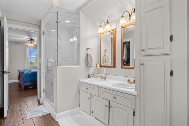 5160 Barker Rd, Jonesville, MI 49250 - ensuite bathroom with a marble finish shower, ceiling fan, and double vanity