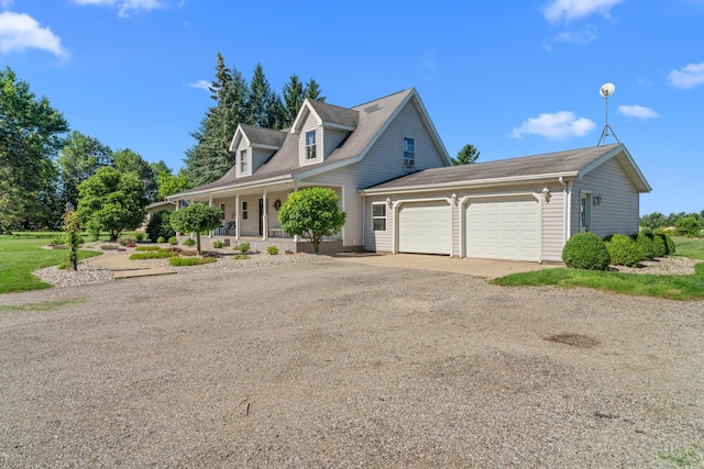 5160 Barker Rd, Jonesville, MI 49250 - new england style home featuring covered porch, a garage, and dirt driveway