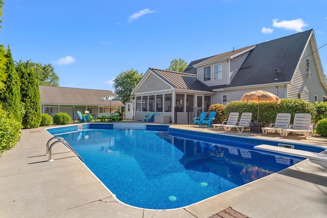 5160 Barker Rd, Jonesville, MI 49250 - outdoor pool with a sunroom, a patio area, and a diving board
