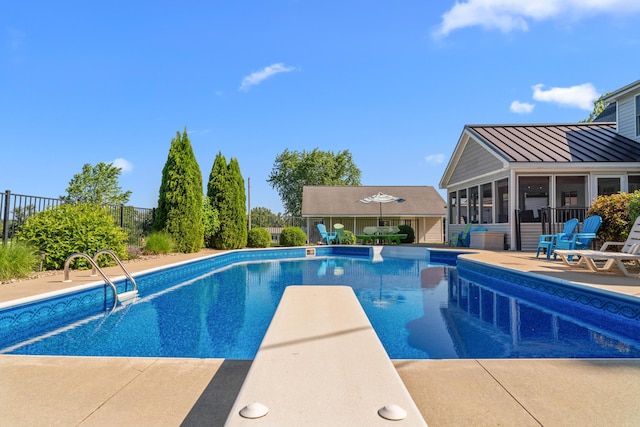 5160 Barker Rd, Jonesville, MI 49250 - outdoor pool with a sunroom, a diving board, and a patio area